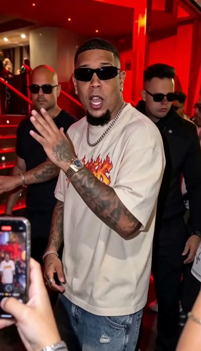 Performer gesturing among a nightclub crowd